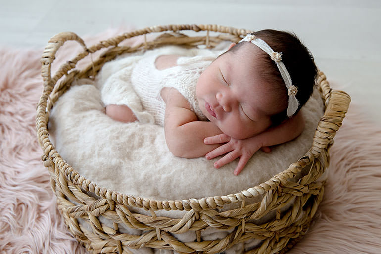 Baby girl in neutral natural newborn photography outfit