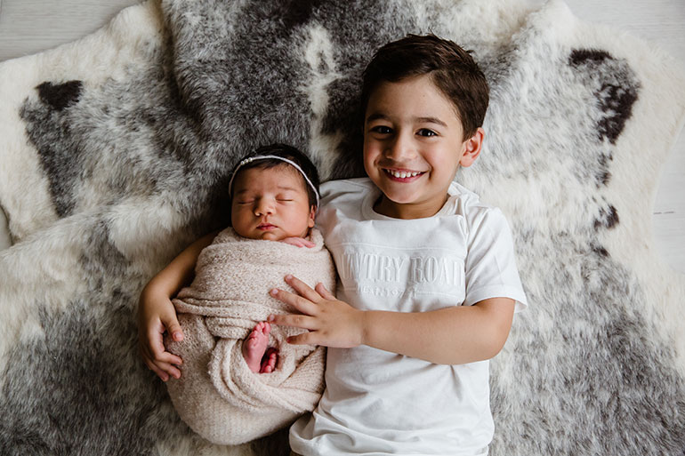 Siblings in light colours - newborn photos Melbourne.