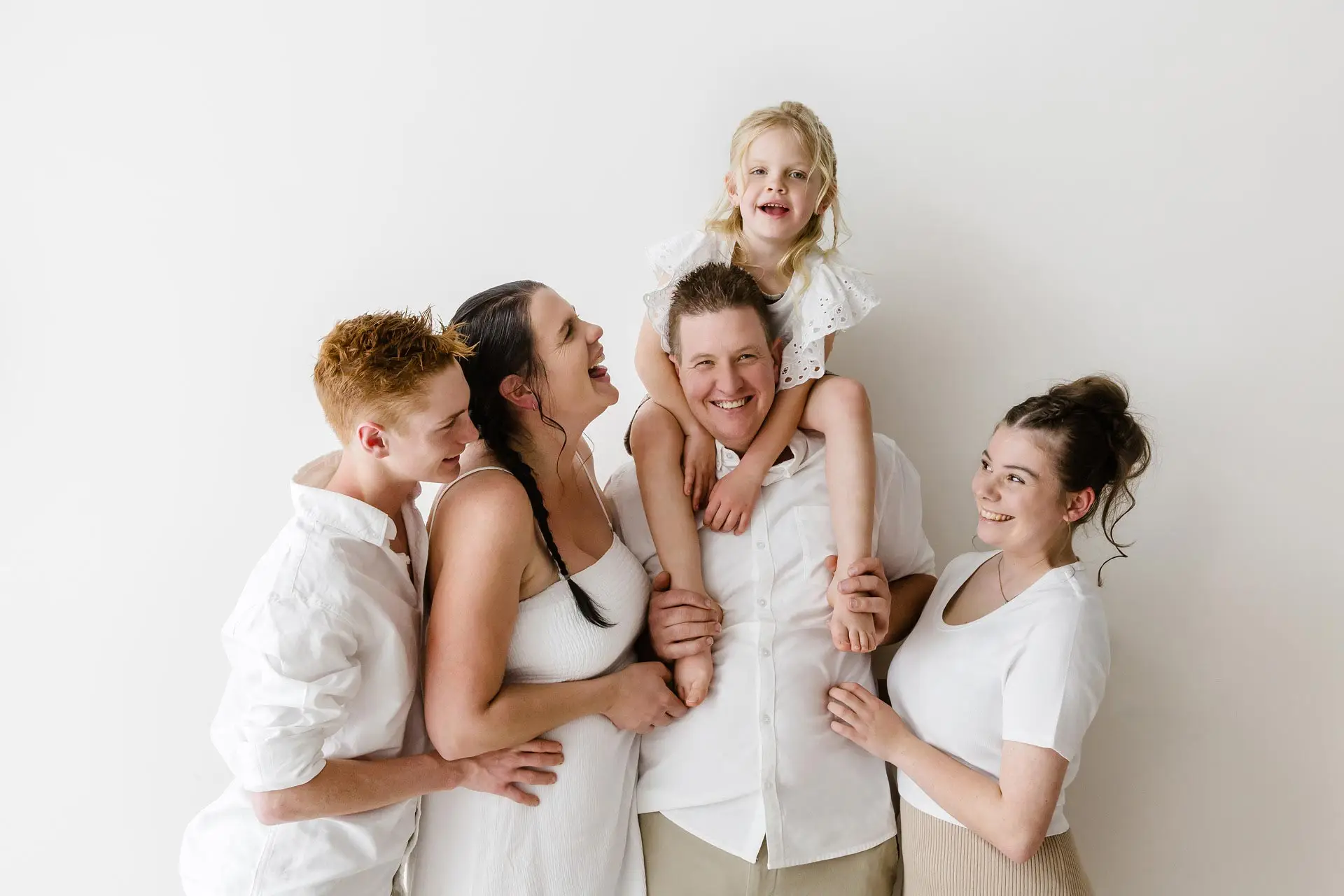 Candid moment of a family laughing and having fun at their Melbourne Photography session.