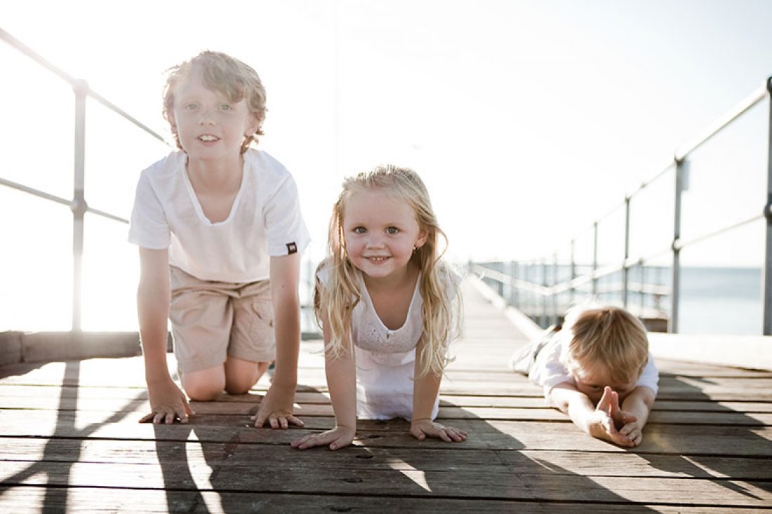 Three siblings at the beach - How to get the best family photos at the beach